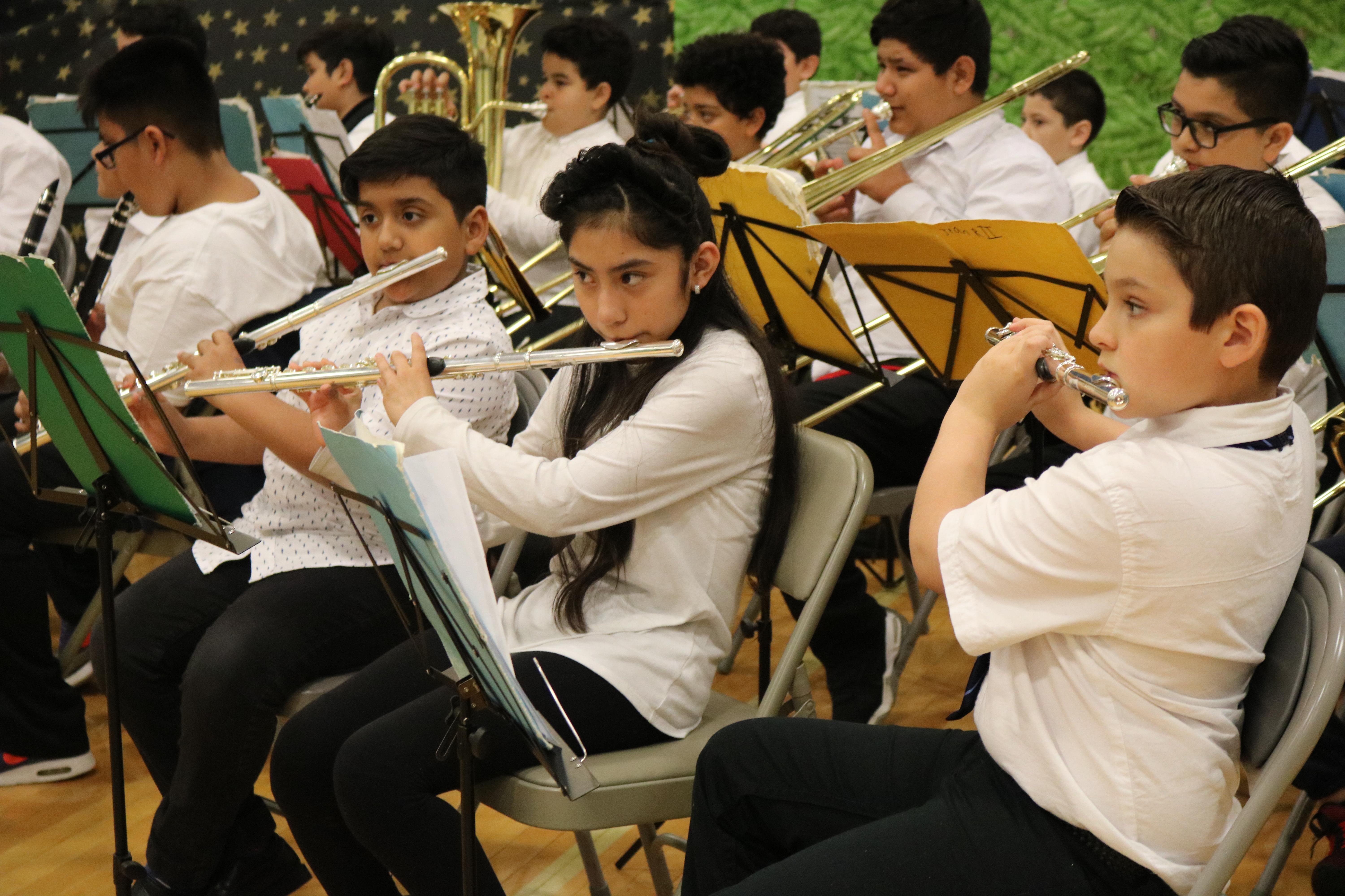 close up of the children playing the flute