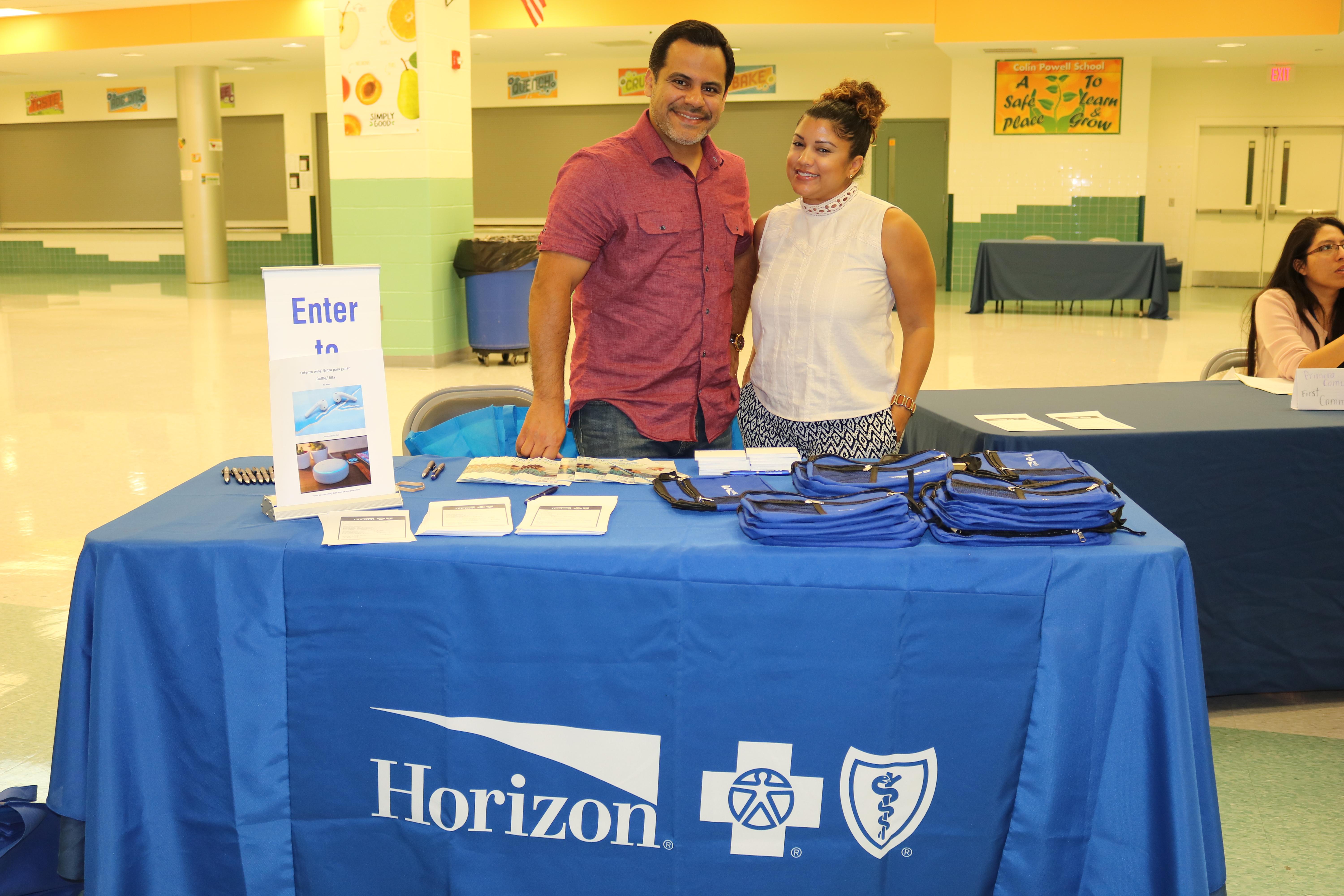 Horizon Representatives at the table with information and gifts
