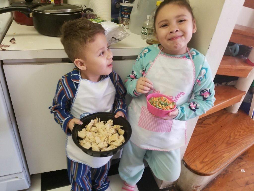 brother and sister cooking at home